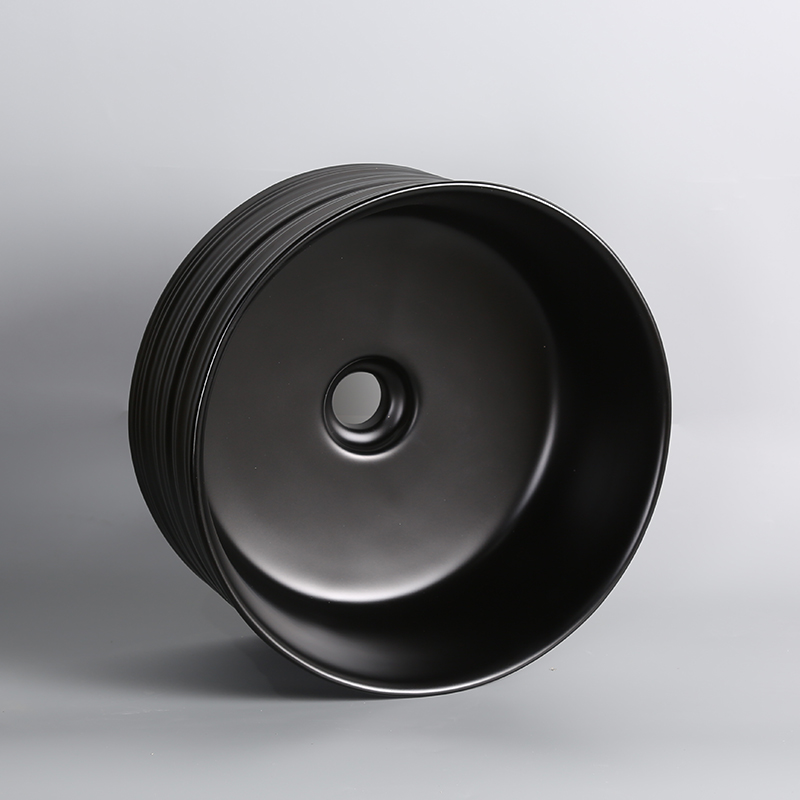 chaozhou Matte black bathroom ceramic relief round circular wash art basin for sale